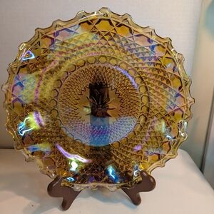 This is a vintage Indiana Glass Company marigold carnival glass hostess plate.